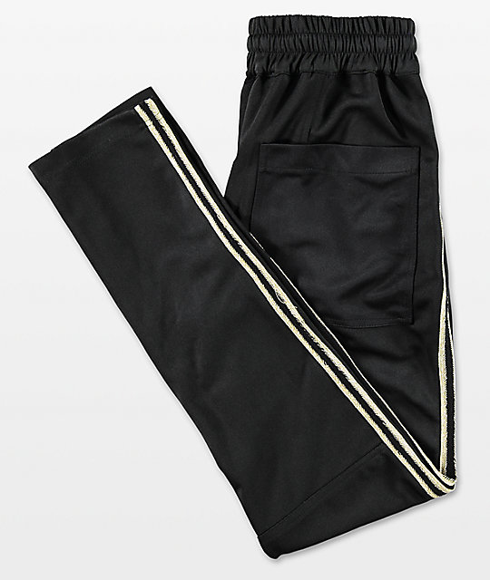 black and gold track pants