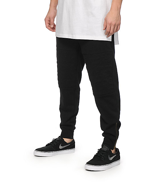 black sweatpants with white stars