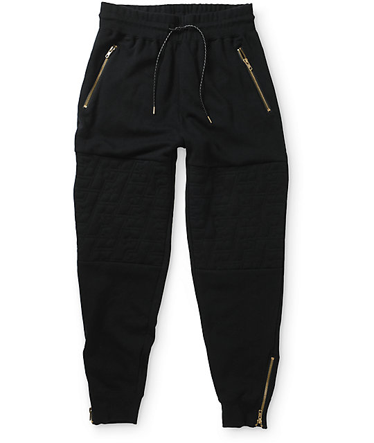 black sweatpants with white stars