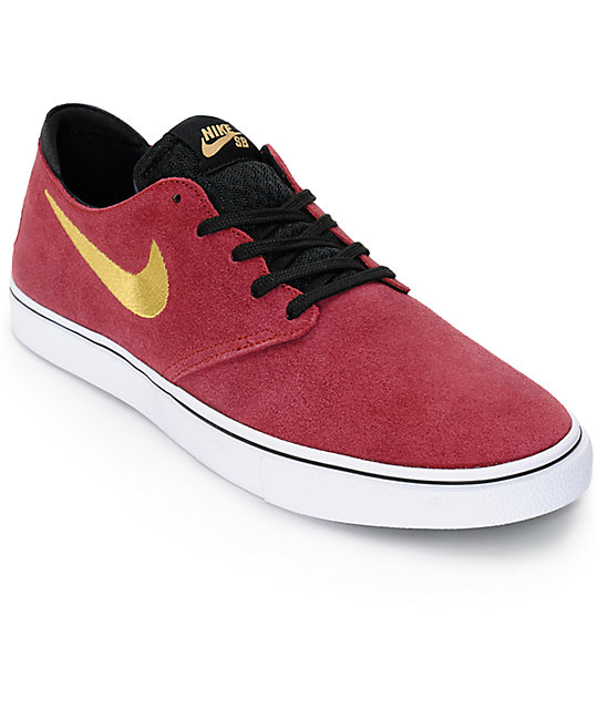 red and gold nike shoes