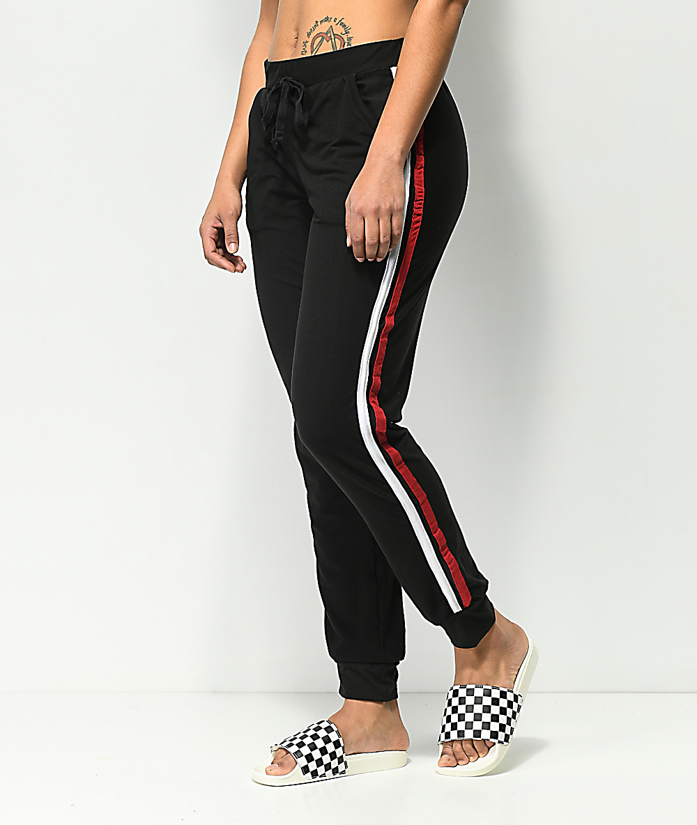 black joggers with red stripe