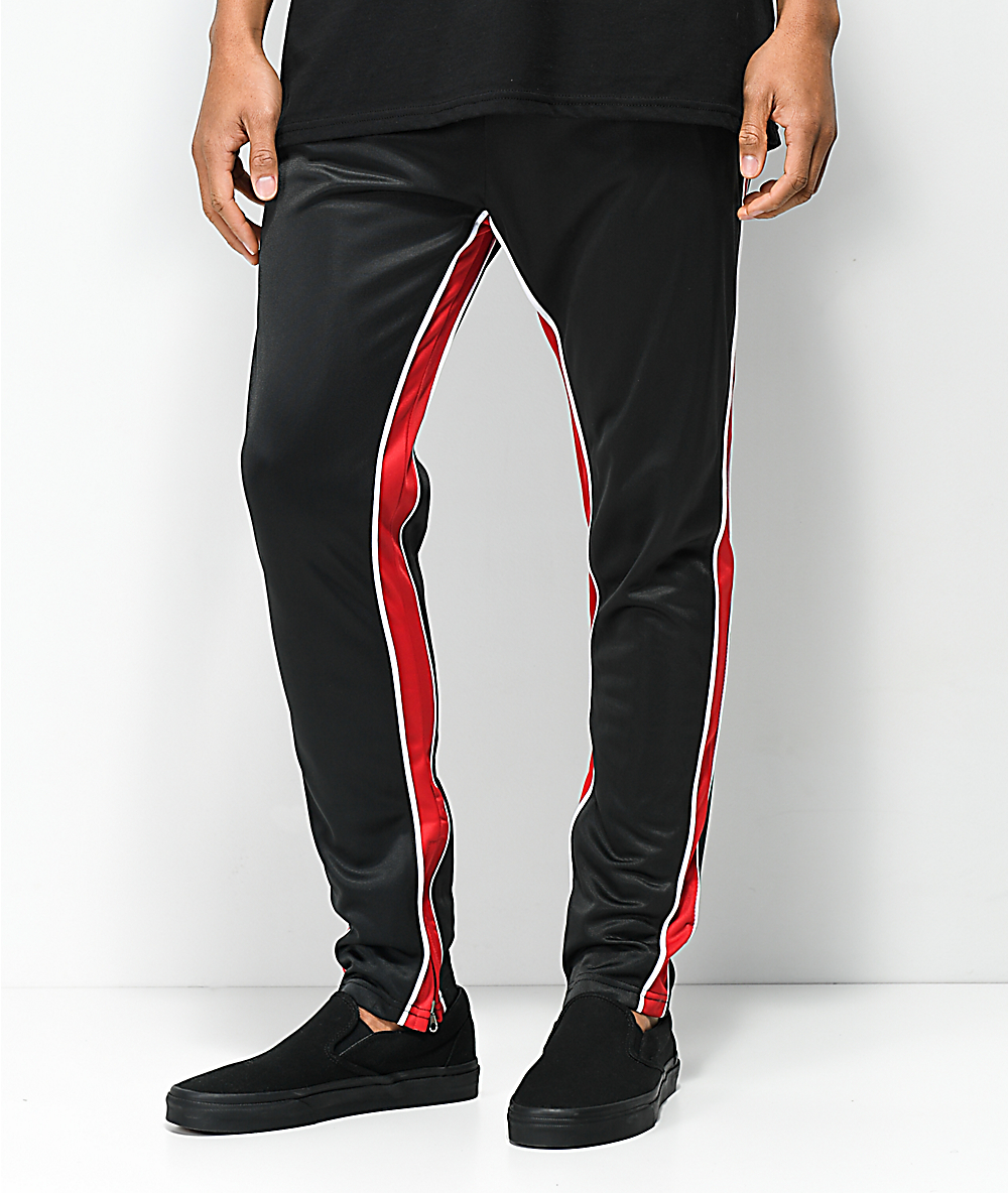 black tracksuit bottoms with red stripe