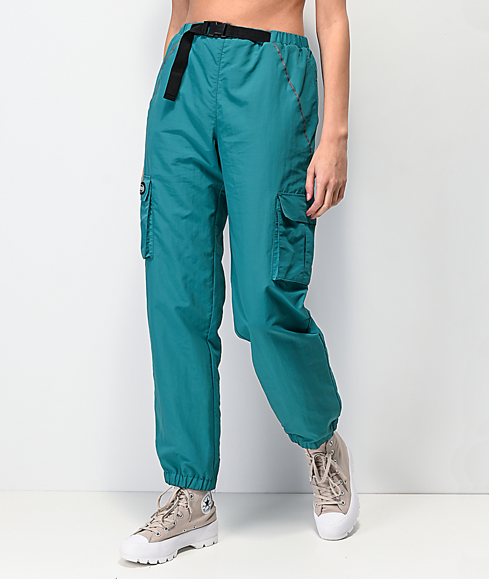 turquoise track pants