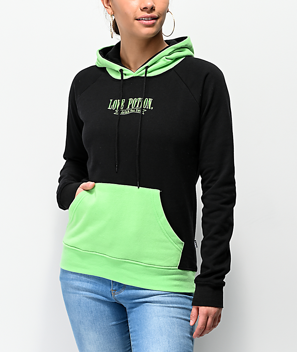 green hoodie black jeans