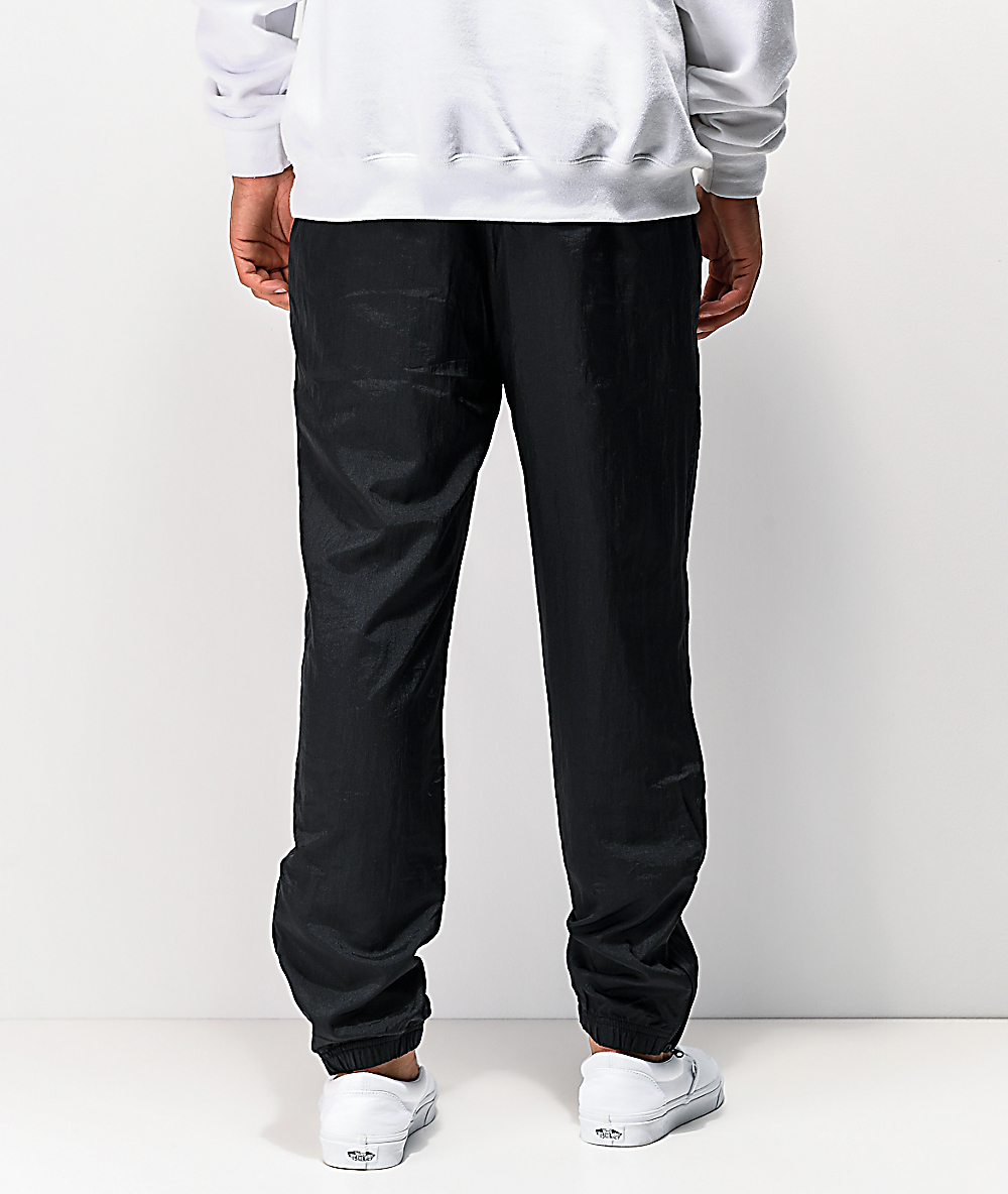 lined nylon warm up pants