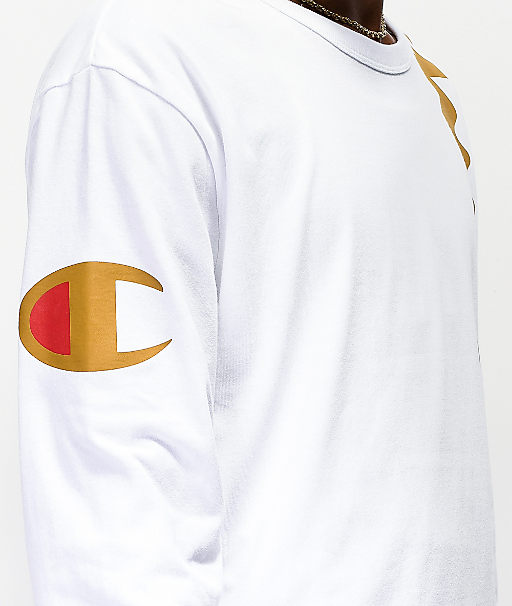 camiseta blanca y dorada