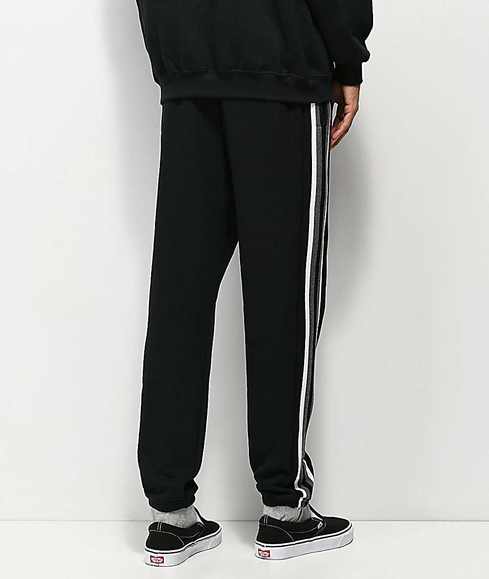 black joggers with white stripe