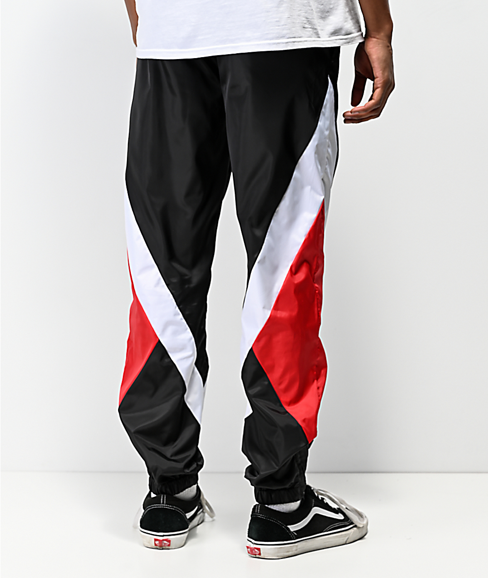black swishy track pants