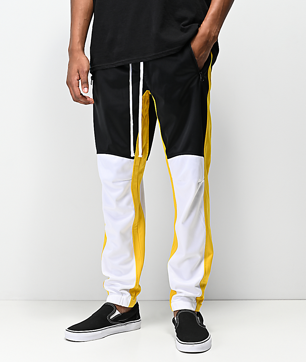 yellow black and white track pants