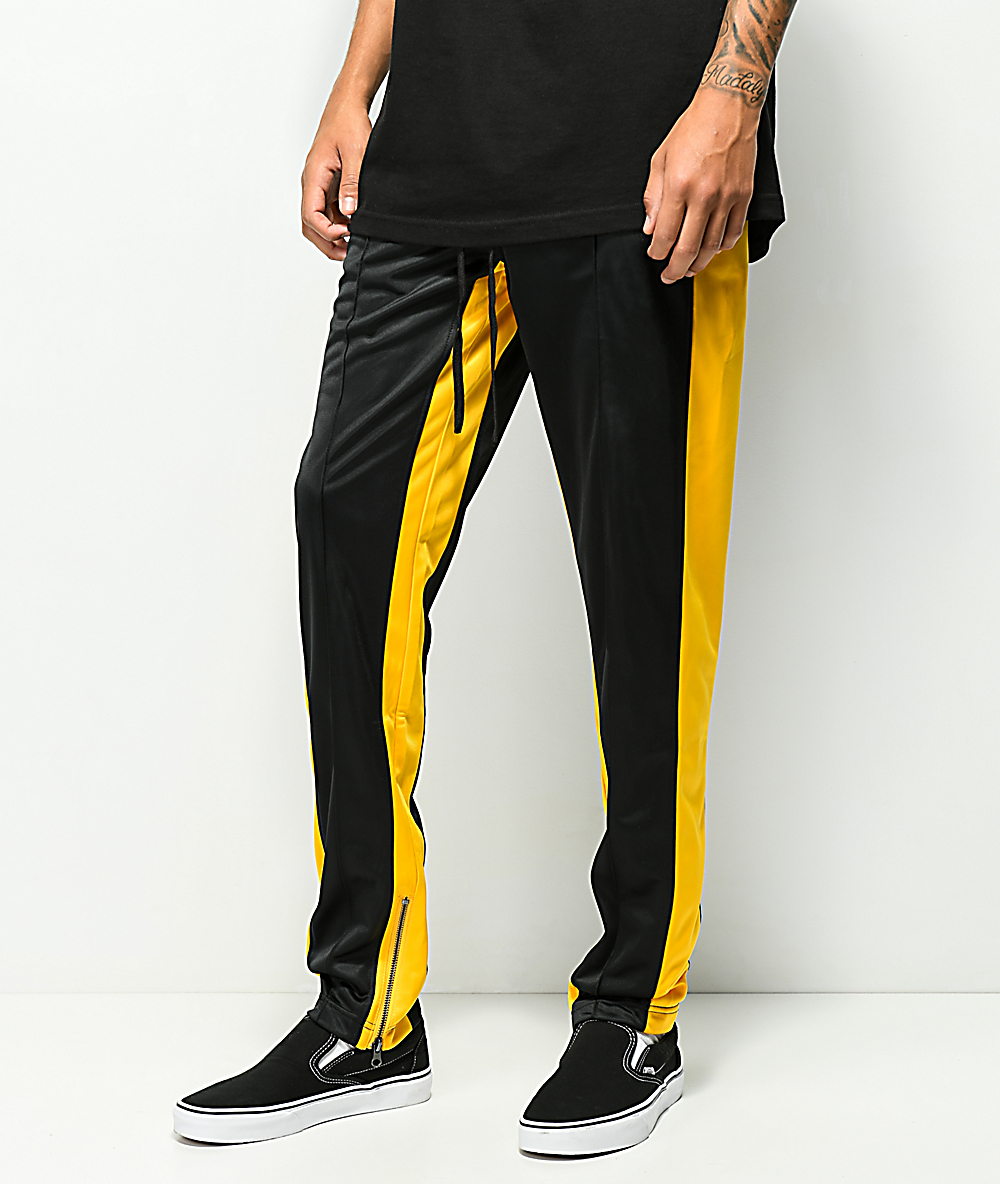 track pants black and yellow