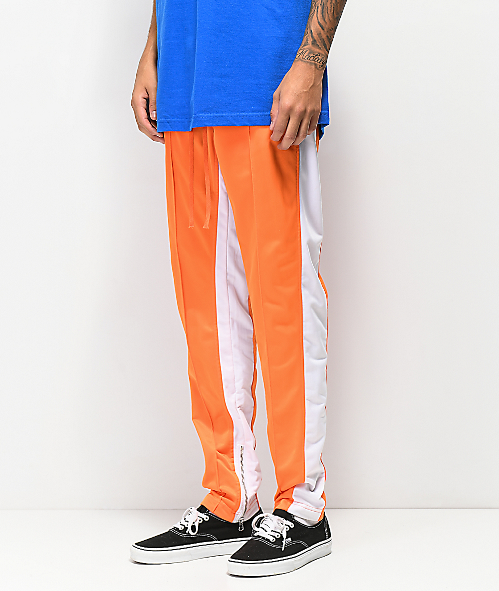 orange and white track pants