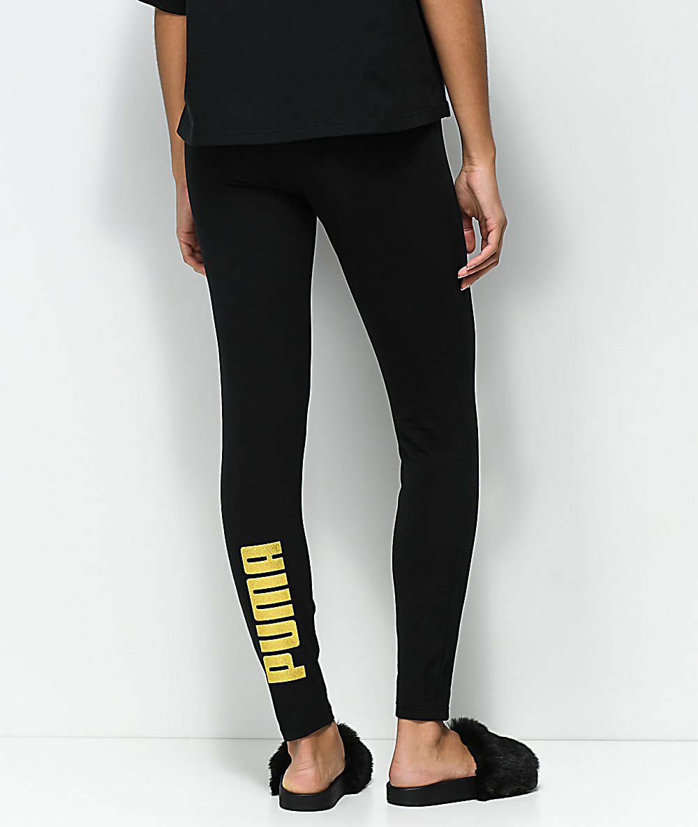 black and gold puma pants