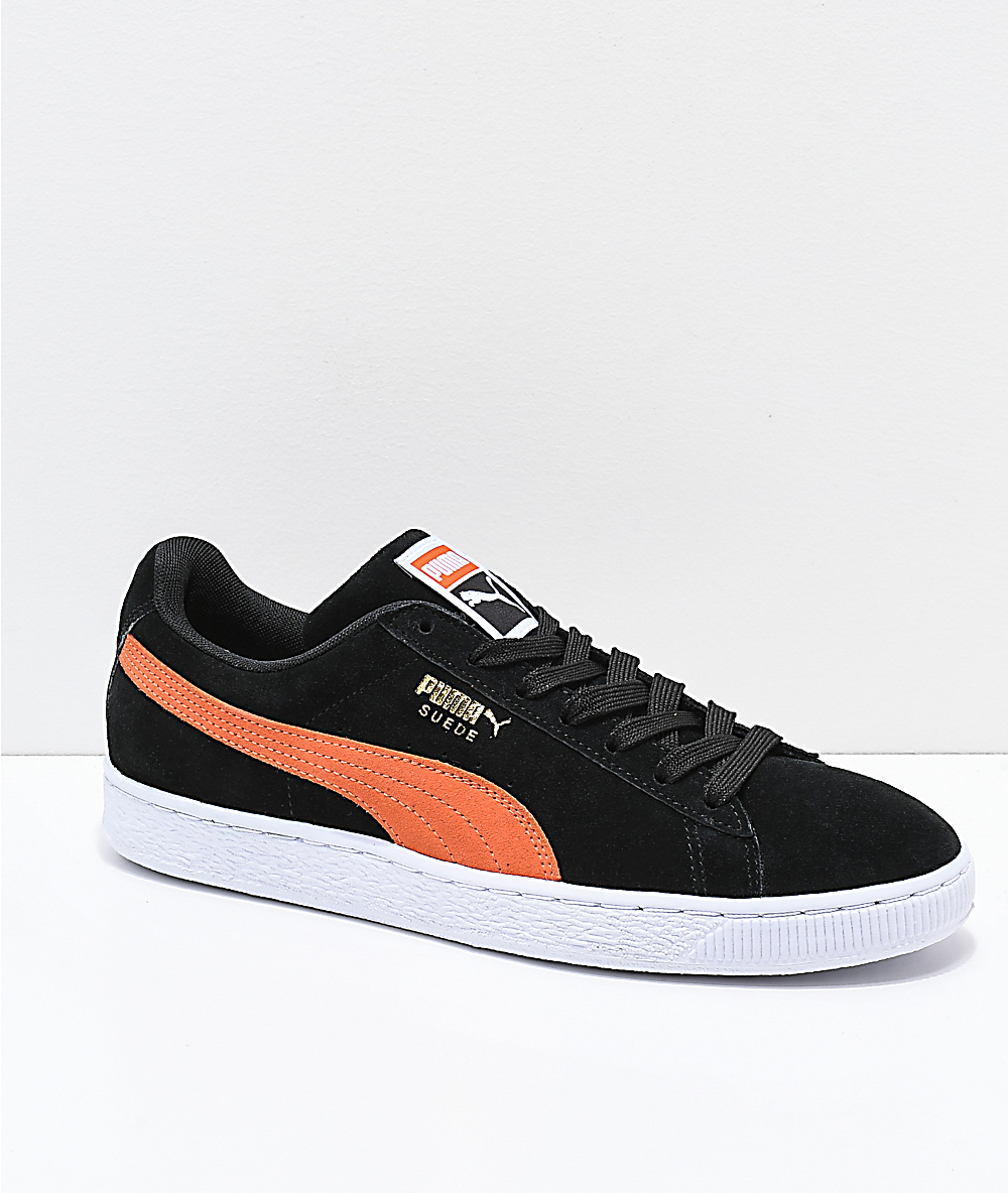 orange and black puma shoes