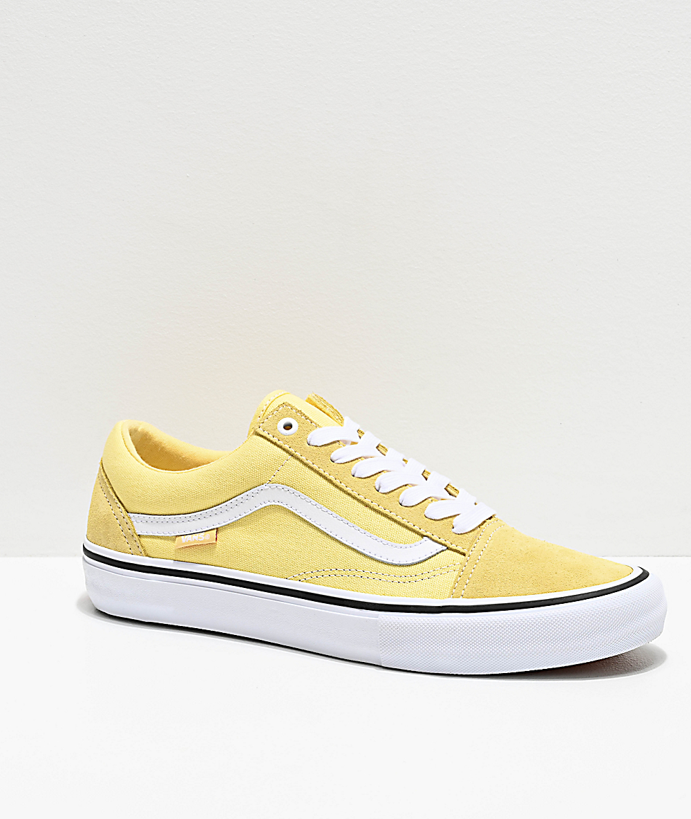 yellow and white old skool vans