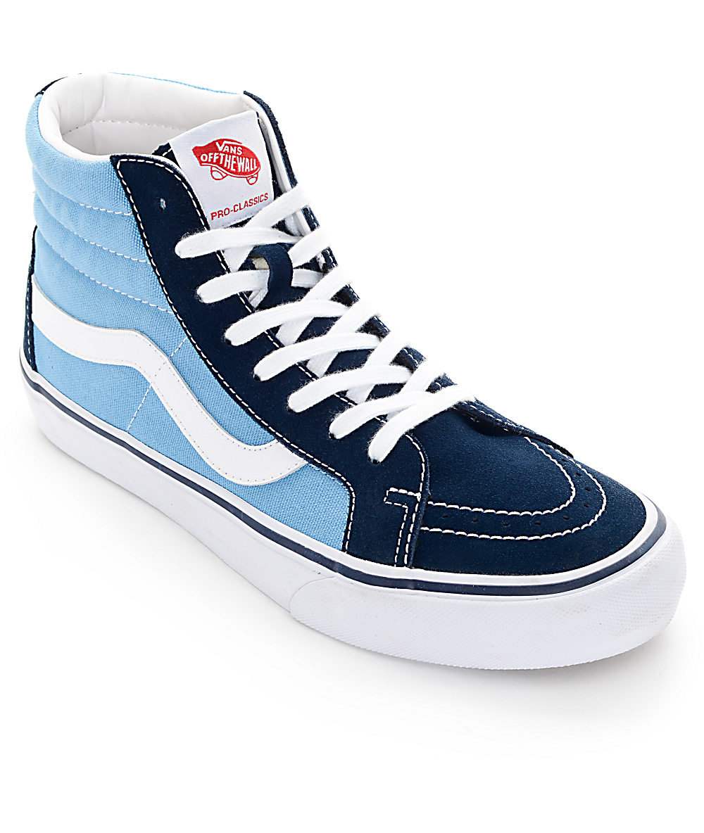navy blue and white vans