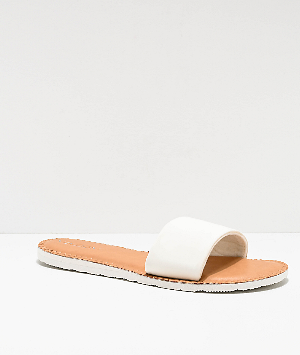 white and tan sandals