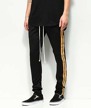 EPTM. pantalones de chándal reflectantes en negro y naranja