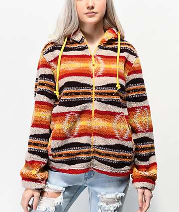 Empyre Peak sudadera de polar con estampado tribal naranja, blanco y marrón