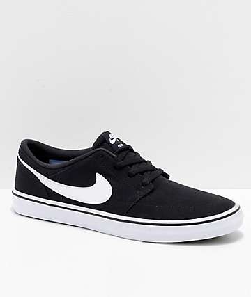 Nike sb portmore ii black hot sale & white canvas skate shoes