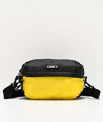 Obey Commuter Traveler bolso de hombro negro y amarillo