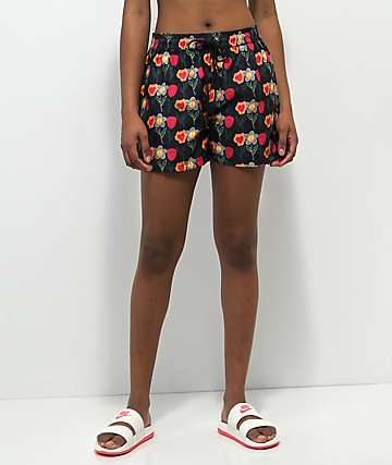 Petals by Petals and Peacocks Flower Print Board shorts negros