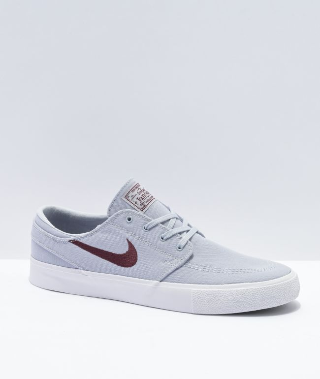 grey and maroon nike shoes