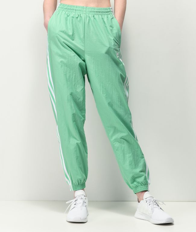 green adidas track pants