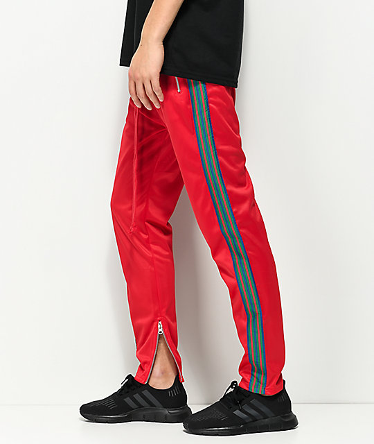 men's green track pants with red stripe