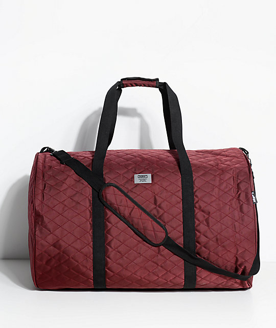 burgundy duffle bag