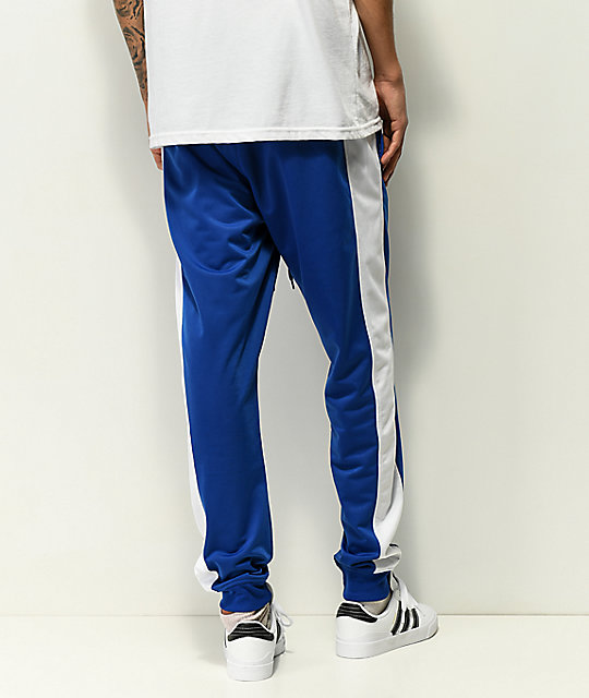 white and blue track pants