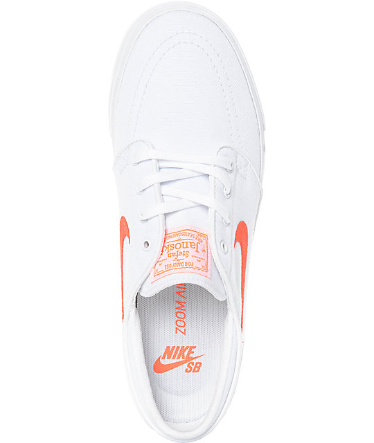 white nike shoes with orange