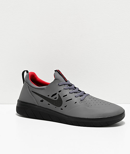 grey and red nike shoes