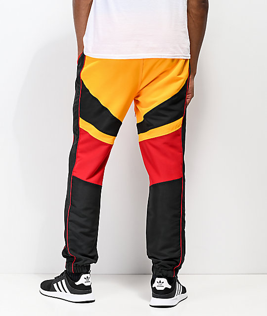 red and yellow track pants