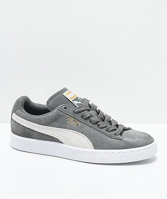 grey and green puma shoes