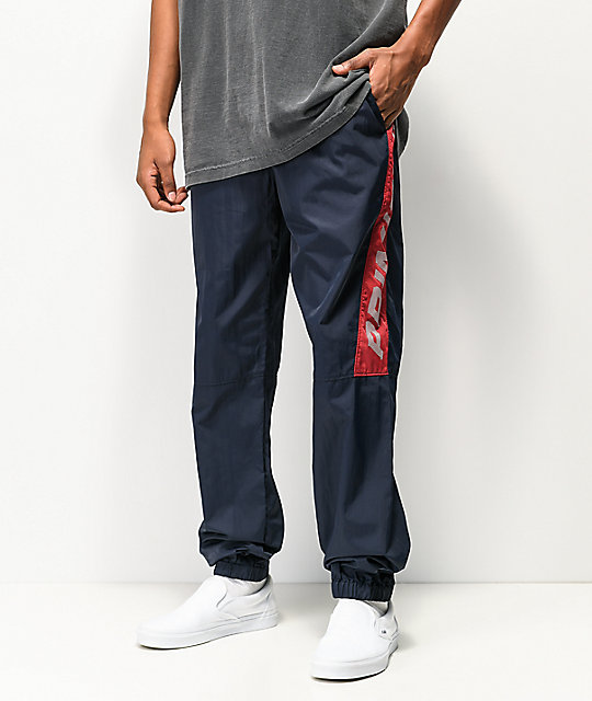 navy and red track pants