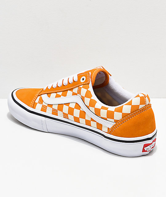orange checkered slip on vans