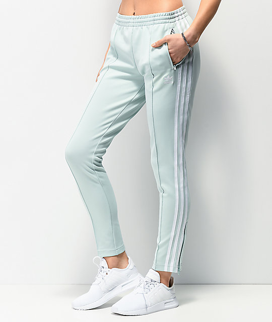 green and white adidas track pants
