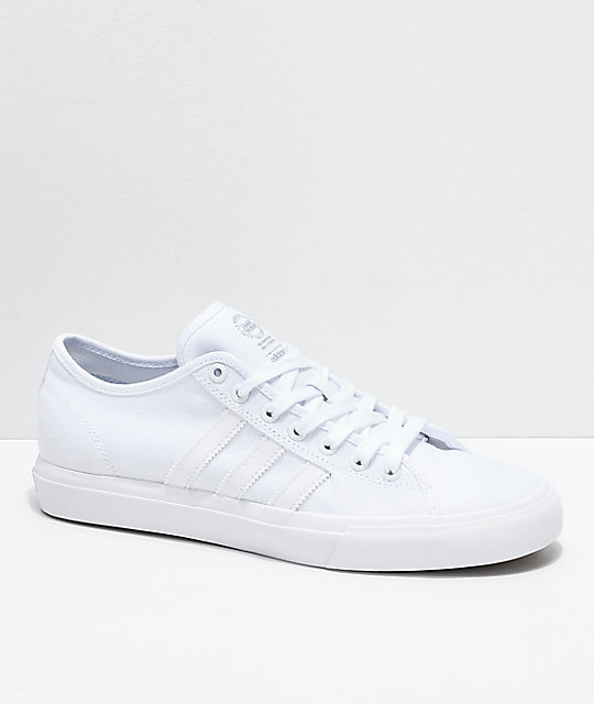 white canvas adidas trainers