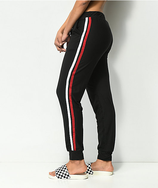 red joggers with white stripe