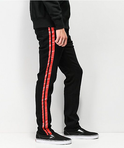 black jeans with red paint