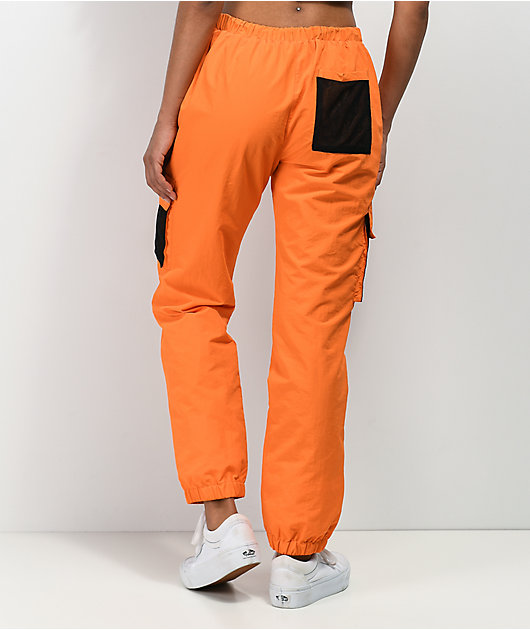 By Samii Ryan Just Leave Orange Crinkle Track Pants
