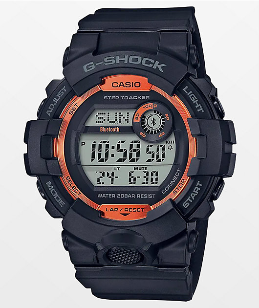 black and orange g shock watch