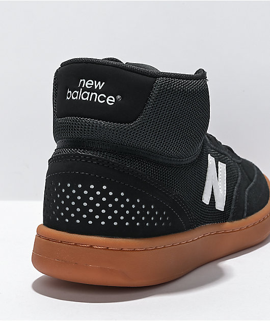 Black new balance high 2024 tops