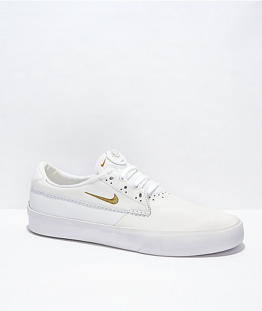 Nike Shane zapatos skate blancos y dorados