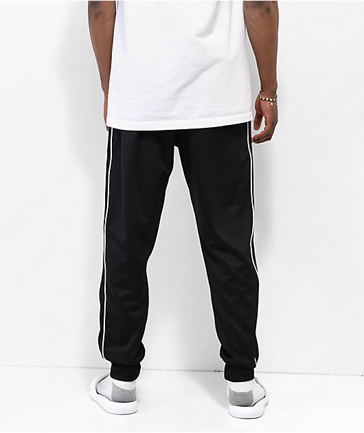 Nike black sweatpants with white stripe sale