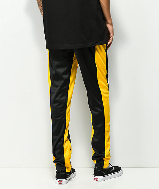 black and yellow track pants