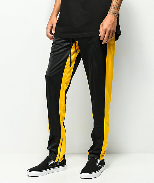 black and yellow tracksuit bottoms