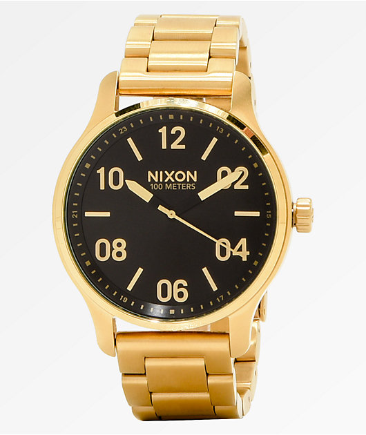 Nixon black and gold watch best sale