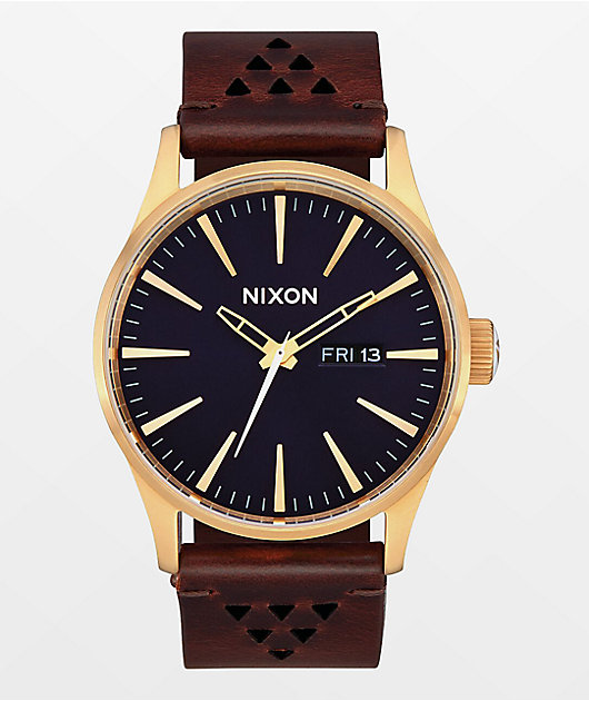 Nixon Sentry Reloj analógico de cuero dorado, índigo y marrón