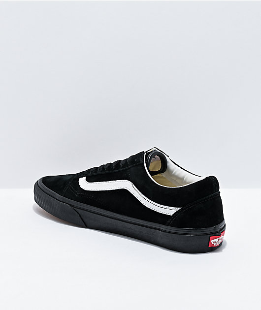 Black and white store suede vans